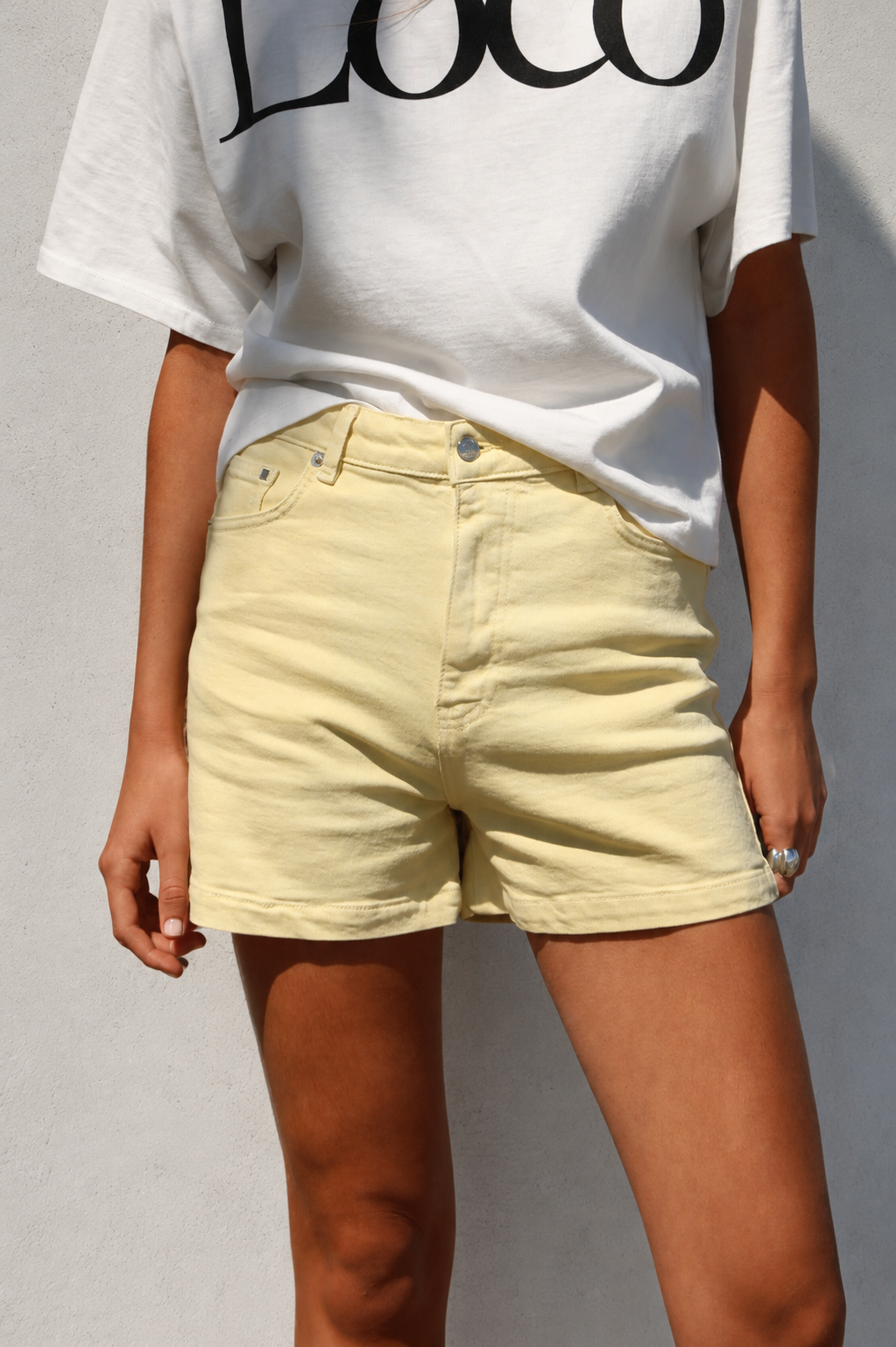 YELLOW MID-RISE TRUFFLE SHORTS